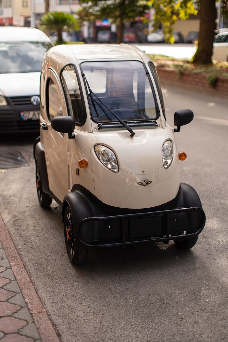 a small car parked on the side of the road